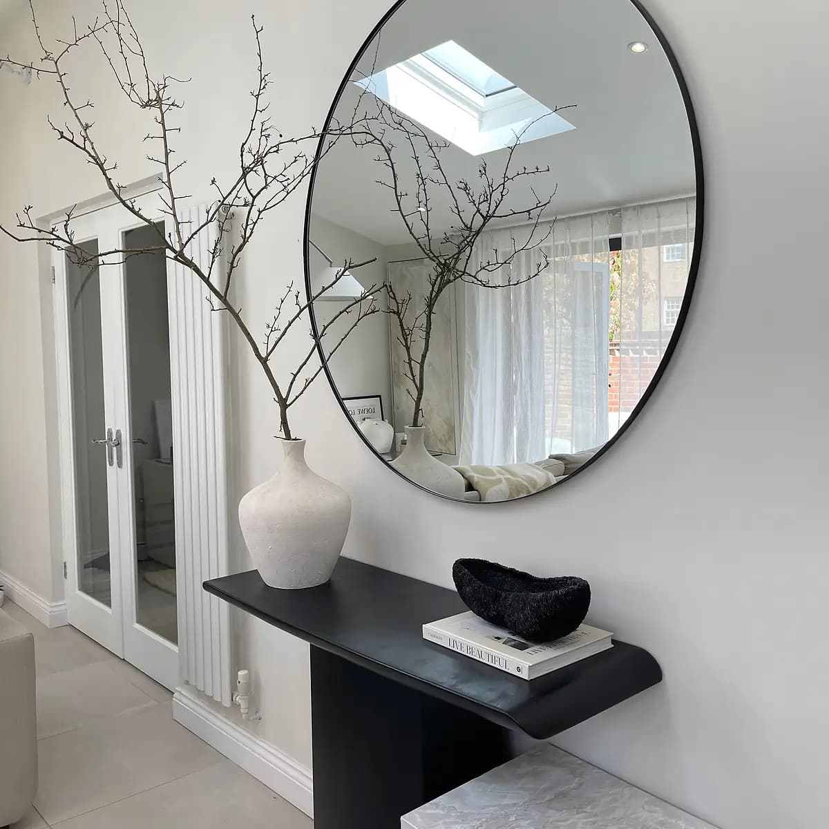 Living Room Mirrors That Add Style, Light, and Luxury